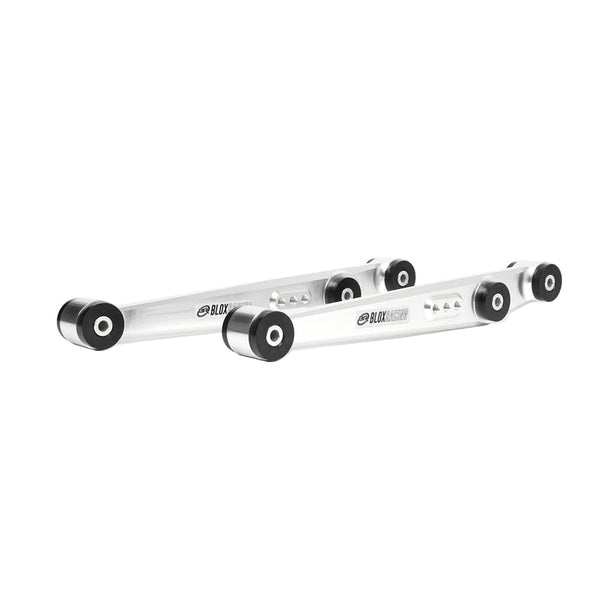 BLOX Racing performance rear lower control arms made from silver billet aluminum, with black bushings installed for a suspension upgrade.